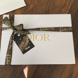 Dior beauty gift box with gold and black ribbon